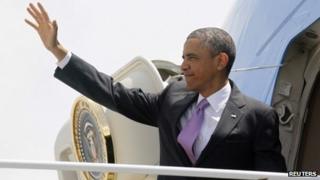 US President Barack Obama waves from Air Force One at Chicago's O'Hare Airport 30 May 2013
