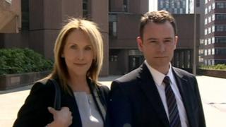 Andrew Watkinson posed for photographs with his wife Louise outside court