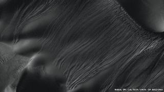 Several types of downhill flow features have been observed on Mars. This is an example of a type called "linear gullies"