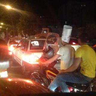 political posters, traffic and young supporters on the streets of Tehran