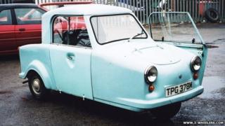 A light blue AC invacar