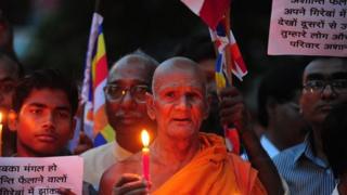 Buddhist monks in northern Indian town of Allahabad held a vigil against the blasts in Bodh Gaya