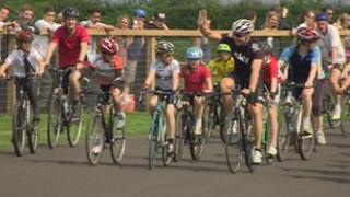 Sir Chris Hoy cycles around the Odd Down track