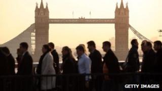 City workers cross London Bridge