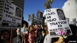 People participate in a rally organized by the Act Now to Stop War and End Racism (ANSWER) coalition to protest the acquittal of George Zimmerman for the shooting death of Florida teenager Trayvon Martin, in Los Angeles, California 16 July 2013
