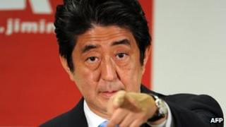 Japanese Prime Minister and ruling Liberal Democratic Party (LDP) leader Shinzo Abe during a press conference at the LDP headquarters in Tokyo on 22 July 2013