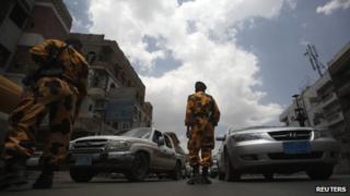 Yemeni police guard a checkpoint on a street in Sanaa on 10 August 2013