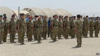 Undated handout photo issued by the MoD of the flag ceremony in Camp Bastion to mark the relocation of the headquarters of Task Force Helmand from Lashkar Gah