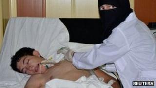 A youth, affected by what activists say is toxic gas, is treated at a hospital in the Duma neighbourhood of Damascus August 21, 2013
