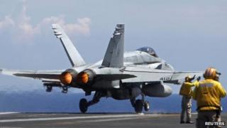 A US Navy F/A-18 Hornet plane takes off the USS Nimitz aircraft carrier. Photo: May 2013