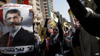 Supporters of ousted President Mohamed Morsi demonstrate in Cairo on 30 August
