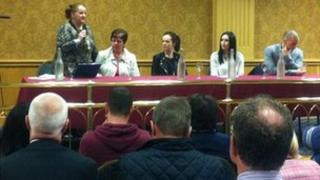 Organiser Catherine Logue addresses the public meeting
