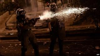 Greek riot police fire tear gas towards protesters during clashes in Athens on September 18, 2013.