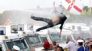 Protester falling from roof