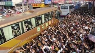 Parents see off children for college exam in China