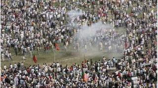 Smoke rises after a bomb exploded near a public ground where Narendra Modi was to address a rally in Patna October 27