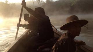 Early morning boat journey from base camp to search for a herd of elephants in Taung Lay