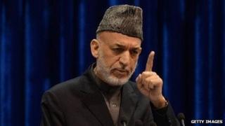 Afghan President Hamid Karzai speaks to the loya jirga on November 24, 2013.
