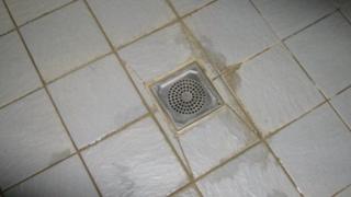 The drain down which the sodium hydroxide was poured