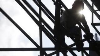 Construction worker on scaffold