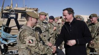 David Cameron shakes hands with a soldier in Afghanistan