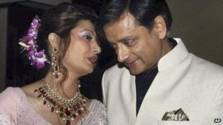 Shashi Tharoor listens to his wife Sunanda Pushkar at their wedding reception in Delhi, September 2010