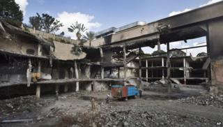 Workers remove rubble from the damaged Westgate Mall in Nairobi