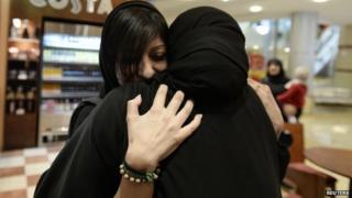 Zainab al-Khawaja hugs Sumaiya Rajab, the wife of jailed activist Nabeel Rajab, following her release (17 February 2014)