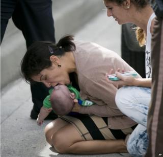 Pamela Rauseo, 37, performs CPR on her nephew, five-month-old Sebastian de la Cruz 20 February 2014