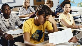 A man is handed an exam paper he has failed
