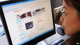 A Chinese woman looks at Taobao.com