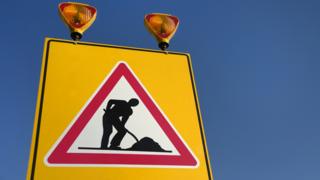 Men at work sign