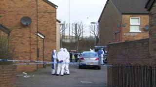 Police at scene of murder in Ardoyne Place