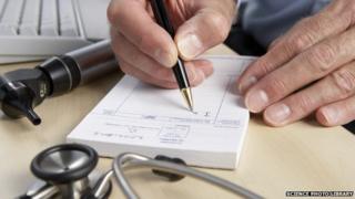 GP writing prescription