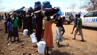 South Sudanese refugees walk towards Kule refugee camp near the Pagak Border Entry point in the Gambella Region, Ethiopia, on 18 March 2014.