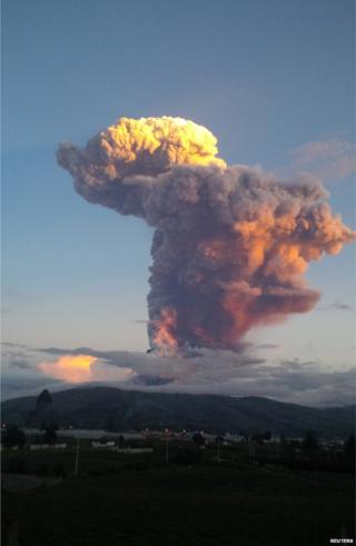 The Tungurahua volcano erupting is seen from Banos, Ecuador on April 4