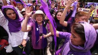 Supporters of the birth control law celebrate outside the Philippine supreme court