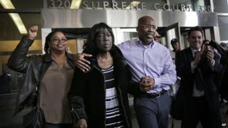 Jonathan Fleming, second from right, exits the courthouse with his mother Patricia Fleming, second from right, in New York, 8 April 2014