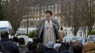 Abu Hamza al-Masri addressing followers during Friday prayer in the street next to Finsbury Park mosque in 2004