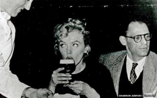 Marilyn Monroe (drinking Guinness) and Arthur Miller