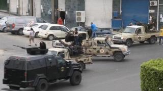 Security forces in Tripoli stand guard near the parliament building amid attacks by militants - 18 May 2014