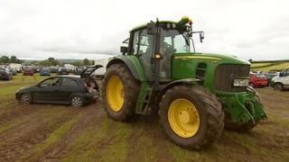A tractor towed cars out of the car park