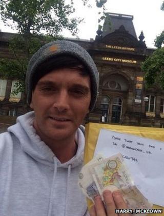 Harry Mckeown holds up his winning envelope