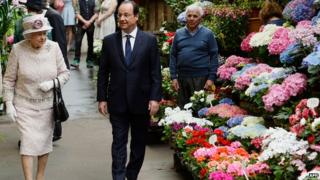 The Queen was shown around the flower market by French President Francois Hollande.