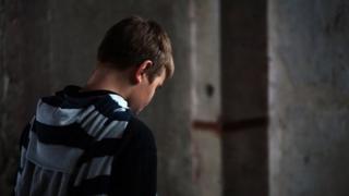Boy with back to camera