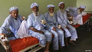 Elders with bandaged hands after their fingers were allegedly cut off by the Taliban for voting. 15 June 2014
