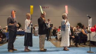 Commissioners and advisors wait in line to debate a vote on whether the church should recognize same-sex marriage at the 221st General Assembly of the Presbyterian Church at Cobo Hall, in Detroit, 19 June 2014