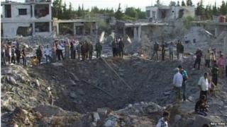 Scene of car bombing in Hama (20/06/14) - picture from Syria's national news agency Sana