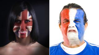 Woman with Union Flag on her Face and man with French flag on face