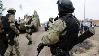 Ukrainian servicemen stand at a military camp near the town of Svyatogorsk in Eastern Ukraine, 20 June 2014